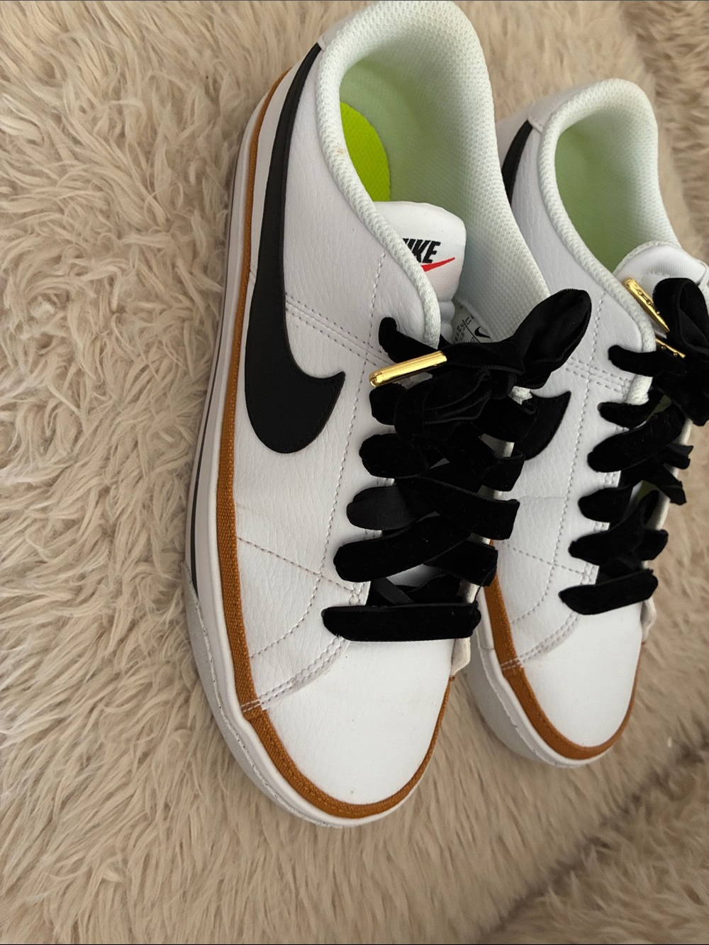 Nike White Low-Top Sneakers with Black Swoosh and Brown Trim